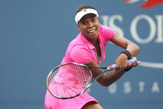 NEW YORK - SEPTEMBER 06:  Venus Williams of the United States returns a shot against Kim Clijsters of Belgium during day seven of the 2009 U.S. Open at the USTA Billie Jean King National Tennis Center on September 6, 2009 in the Flushing neighborhood of t