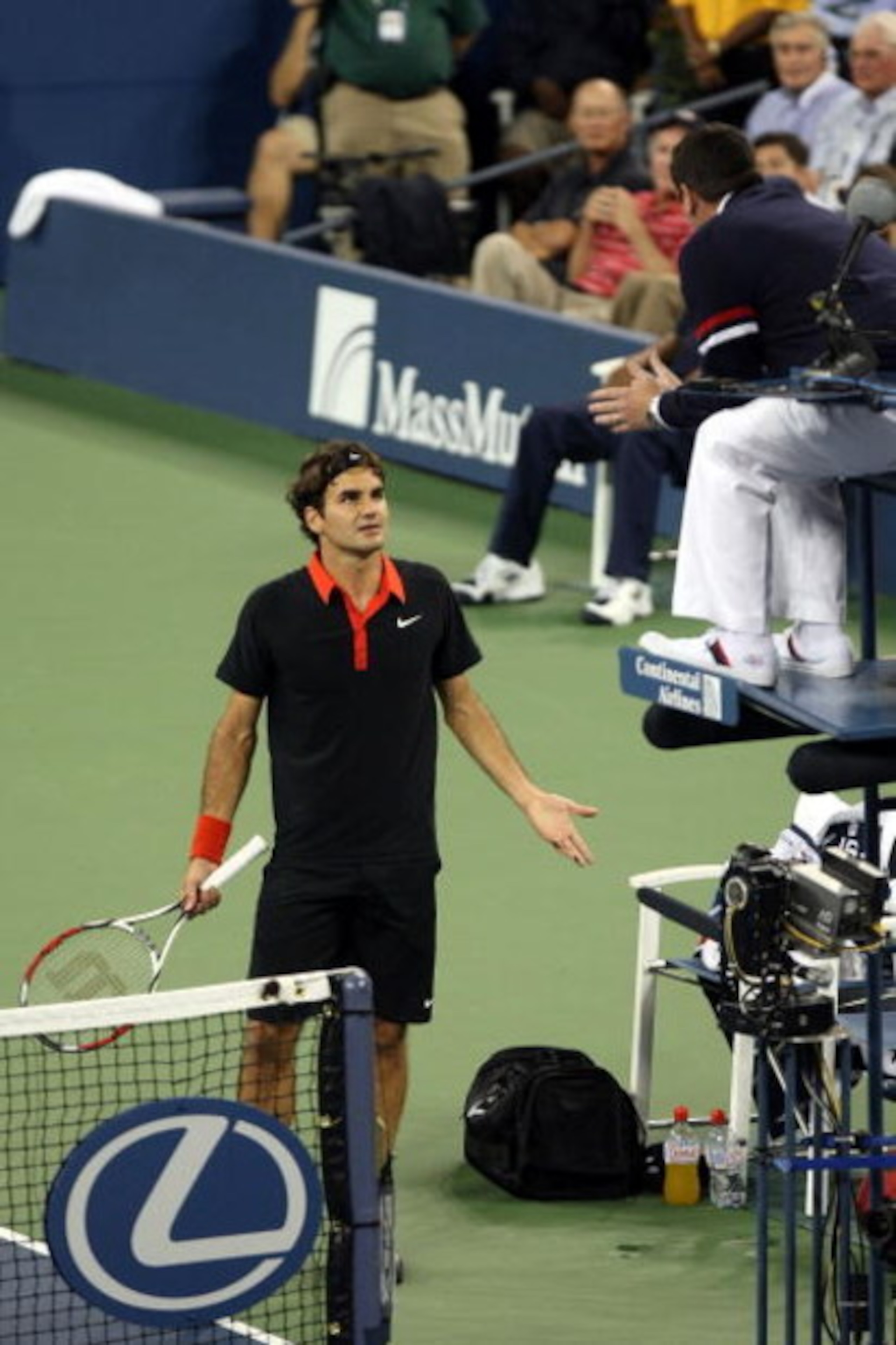 NEW YORK - SEPTEMBER 14: Roger Federer of Switzerland (L) disputes a call in the fourth set tiebreak to chair judge Jake Garner during the Men�s Singles final on day fifteen of the 2009 U.S. Open at the USTA Billie Jean King National Tennis Center on Sep NEW YORK - SEPTEMBER 14: Roger Federer of Switzerland (L) disputes a call in the fourth set tiebreak to chair judge Jake Garner during the Men�s Singles final on day fifteen of the 2009 U.S. Open at the USTA Billie Jean King National Tennis Center on Sep