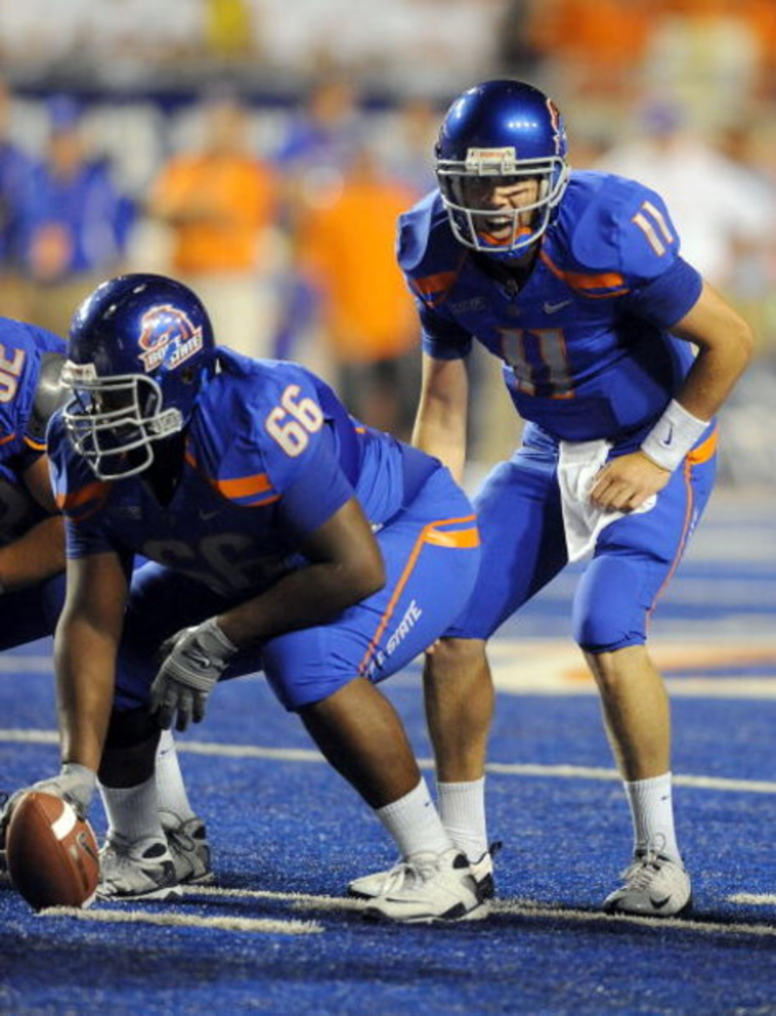 BOISE, ID - SEPTEMBER 3: Quarterback Kellen Moore #6 of the Boise State Broncos barks out signals as center Thomas Byrd #66 of the Boise State Broncos waits to snap the ball in the third quarter of the game against the Oregon Ducks at Bronco Stadium on Se