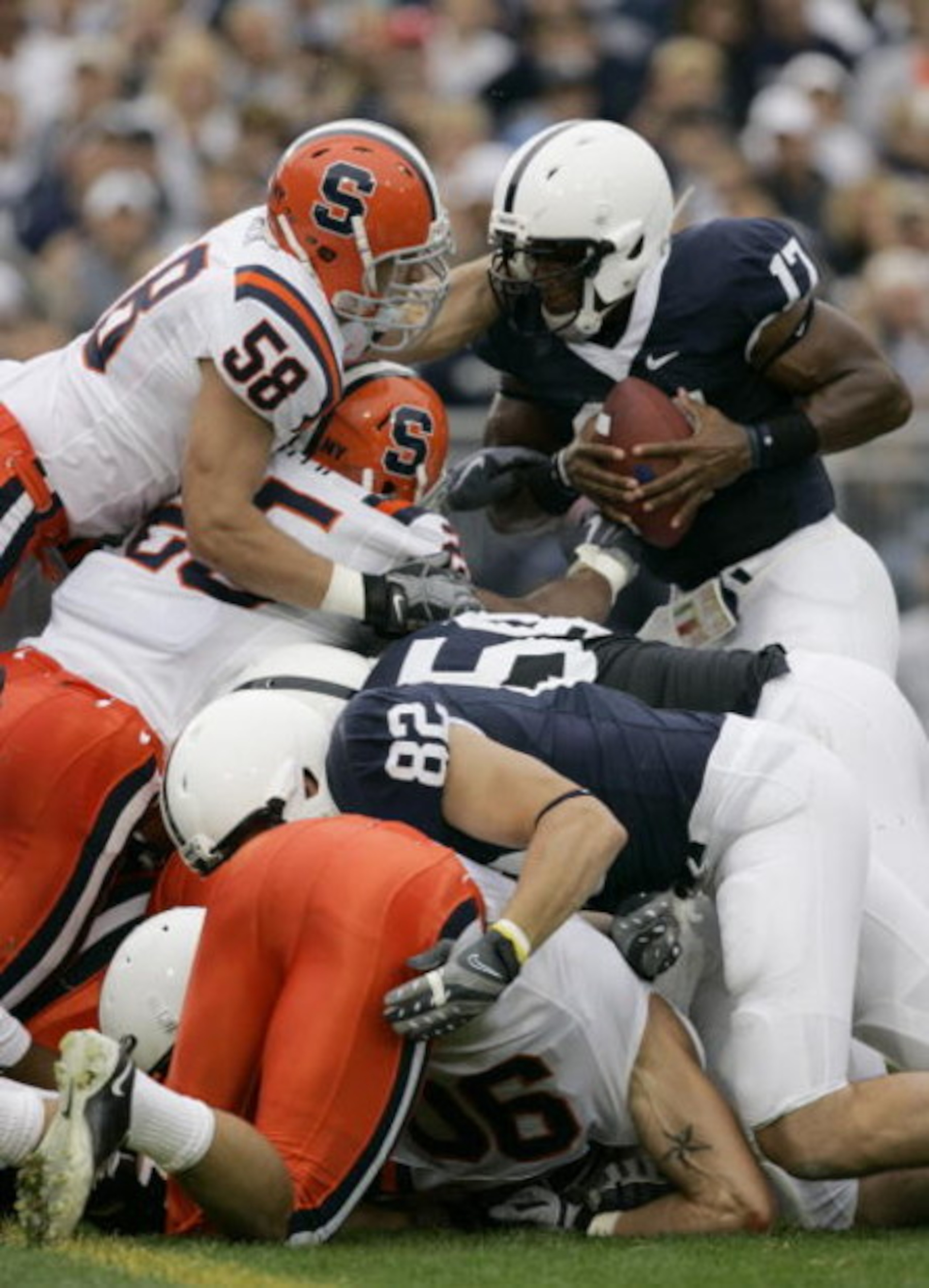 STATE COLLEGE, PA - SEPTEMBER 12: Quarterback Daryll Clark #17 of the Penn State Nittany Lions is stopped on the goal line by linebacker Mike Stenclik of the Syracuse Orangemen during the first half at Beaver Stadium  September 12, 2009 in State College, 