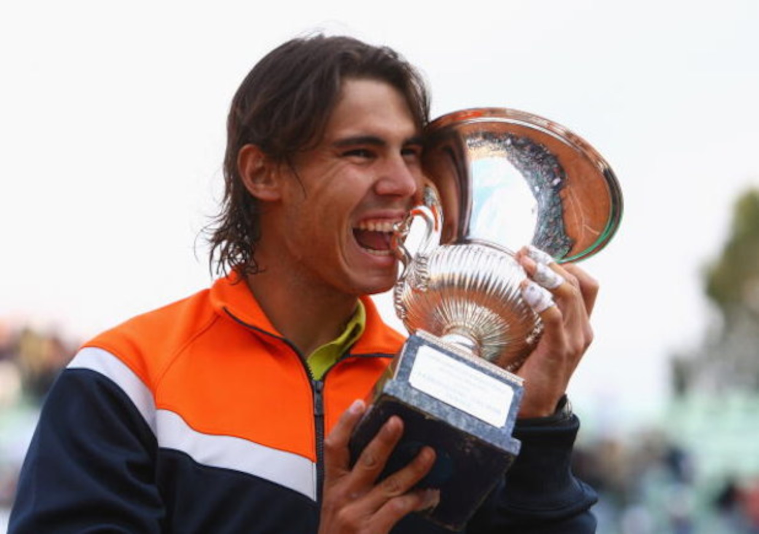 ROME - MAY 03:  Rafael Nadal of Spain bites the trophy after defeating Novak Djokovic of Serbia during day seven of the Foro Italico Tennis Masters on May 3, 2009 in Rome, Italy.  (Photo by Julian Finney/Getty Images)