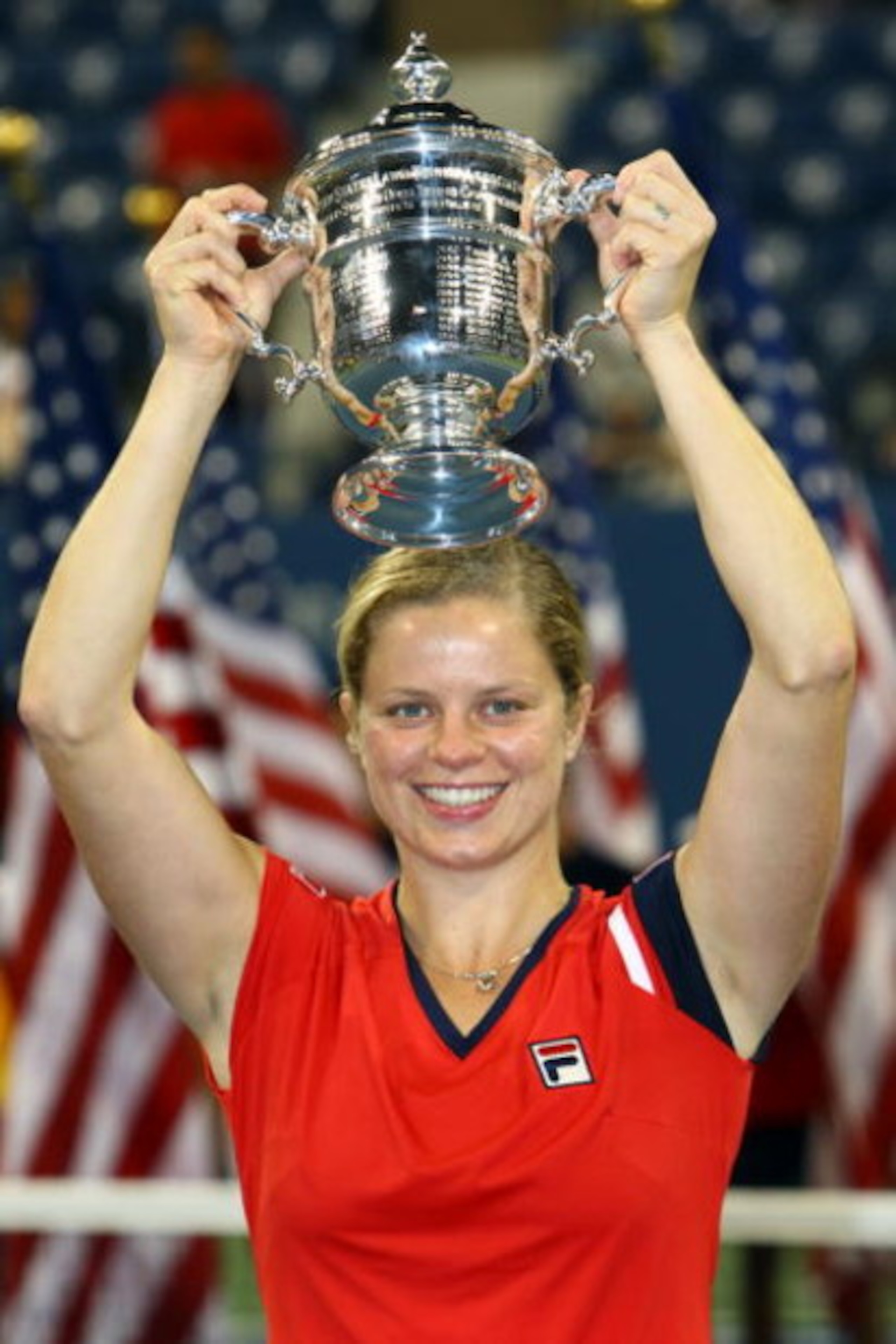 NEW YORK - SEPTEMBER 13:  Kim Clijsters of Belgium holds up the championship trophy after defeating Caroline Wozniacki of Denmark in the Womenï¿½s Singles final on day fourteen of the 2009 U.S. Open at the USTA Billie Jean King National Tennis Center on Sep