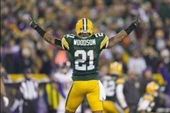 Jan 5, 2013; Green Bay, WI, USA;  Green Bay Packers safety Charles Woodson (21) celebrates a play during the fourth quarter of the NFC Wild Card playoff game against the Minnesota Vikings at Lambeau Field.  The Packers won 24-10.  Mandatory Credit: Jeff H