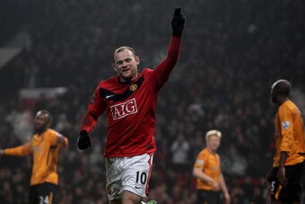MANCHESTER, ENGLAND - JANUARY 23:  Wayne Rooney of Manchester United celebrates scoring his hat-trick during the Barclays Premier League match between Manchester United and Hull City at Old Trafford on January 23, 2010 in Manchester, England.  (Photo by J