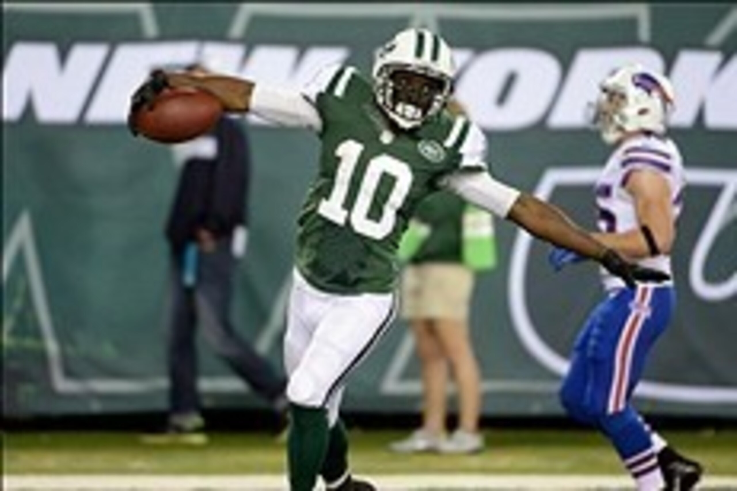 Sep 22, 2013; East Rutherford, NJ, USA; New York Jets wide receiver Santonio Holmes (10) scores a touchdown in the fourth quarter against the Buffalo Bills at MetLife Stadium. Mandatory Credit: Robert Deutsch-USA TODAY Sports Sep 22, 2013; East Rutherford, NJ, USA; New York Jets wide receiver Santonio Holmes (10) scores a touchdown in the fourth quarter against the Buffalo Bills at MetLife Stadium. Mandatory Credit: Robert Deutsch-USA TODAY Sports
