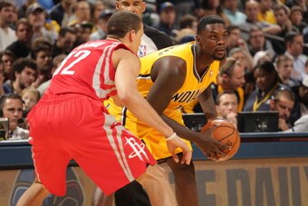 INDIANAPOLIS - DECEMBER 20: Lance Stephenson #1 of the Indiana Pacers controls the ball against the Houston Rockets at Bankers Life Fieldhouse on December 20, 2013 in Indianapolis, Indiana.  NOTE TO USER: User expressly acknowledges and agrees that, by do