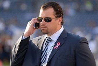 Oct 14, 2013; San Diego, CA, USA; Indianapolis Colts general manager Ryan Grigson talks on a cell phone before the game against the San Diego Chargers at Qualcomm Stadium. Mandatory Credit: Kirby Lee-USA TODAY Sports
