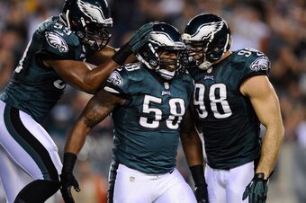 PHILADELPHIA, PA - DECEMBER 22:  Trent Cole #58 celebrates with Connor Barwin #98 and DeMeco Ryans #59 of the Philadelphia Eagles after sacking Jay Cutler #6 of the Chicago Bears during the first quarter at Lincoln Financial Field on December 22, 2013 in 