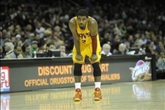 Dec 29, 2013; Cleveland, OH, USA; Cleveland Cavaliers point guard Kyrie Irving reacts in the third quarter against the Golden State Warriors at Quicken Loans Arena. Mandatory Credit: David Richard-USA TODAY Sports