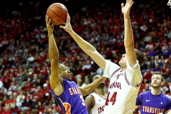 BLOOMINGTON, IN - NOVEMBER 26:  Luke Fischer #44 of the Indiana Hoosiers blocks the shot of Jaylon Brown #3 of  the Evansville Purple Aces during the game at Assembly Hall on November 26, 2013 in Bloomington, Indiana.  (Photo by Andy Lyons/Getty Images)