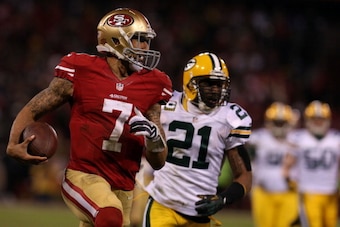 SAN FRANCISCO, CA - JANUARY 12:  Quarterback Colin Kaepernick #7 of the San Francisco 49ers runs the ball against strong safety Charles Woodson #21 of the Green Bay Packers during the NFC Divisional Playoff Game at Candlestick Park on January 12, 2013 in 