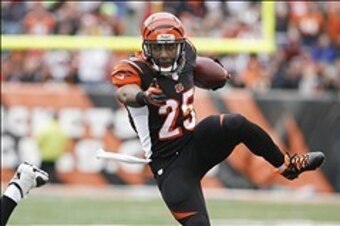 Dec 29, 2013; Cincinnati, OH, USA; Cincinnati Bengals running back Giovani Bernard (25) runs the ball against the Baltimore Ravens in the first half at Paul Brown Stadium. Mandatory Credit: Mark Zerof-USA TODAY Sports