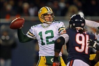 Dec 29, 2013; Chicago, IL, USA; Green Bay Packers quarterback Aaron Rodgers (12) passes during the second half against the Chicago Bears at Soldier Field. Green Bay won 33-28. Mandatory Credit: Dennis Wierzbicki-USA TODAY Sport