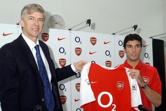 LONDON - JANUARY 30:  Arsenals manager Arsene Wenger (L) poses with his new signing Jose Reyes during a photo opportunity at Arsenal Training Ground, on January 30, 2004 in London. (Photo by John Stillwell-Pool/Getty Images)