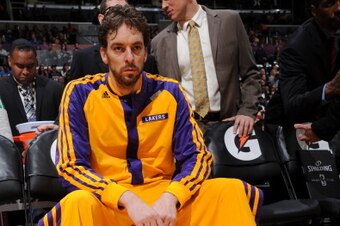 LOS ANGELES, CA - DECEMBER 31: Pau Gasol #16 of the Los Angeles Lakers waits to be introduced before a game against the Milwaukee Bucks at STAPLES Center on December 31, 2013 in Los Angeles, California. NOTE TO USER: User expressly acknowledges and agrees