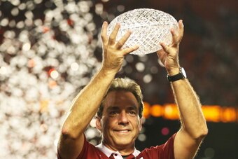 MIAMI GARDENS, FL - JANUARY 07:  Head coach Nick Saban of the Alabama Crimson Tide celebrates with the trophy after defeating the Notre Dame Fighting Irish in the 2013 Discover BCS National Championship game at Sun Life Stadium on January 7, 2013 in Miami