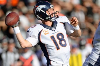 OAKLAND, CA - DECEMBER 29:  Peyton Manning #18 of the Denver Broncos drops back to pass against the Oakland Raiders during the second quarter at O.co Coliseum on December 29, 2013 in Oakland, California.  (Photo by Thearon W. Henderson/Getty Images)