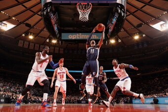 NEW YORK, NY - DECEMBER 21: Mike Conley #11 of the Memphis Grizzlies goes up to shoot during a game against the New York Knicks at Madison Square Garden in New York City on December 21, 2013.  NOTE TO USER: User expressly acknowledges and agrees that, by 