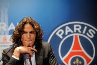 PARIS, FRANCE - JULY 16: Paris Saint-Germain's (PSG) new forward, Edinson Cavani, attends a press conference on July 16, 2013 in Paris, France. Cavani's transfer to Paris Saint-Germain football club is reported to have cost in the region of £55m. (Photo b