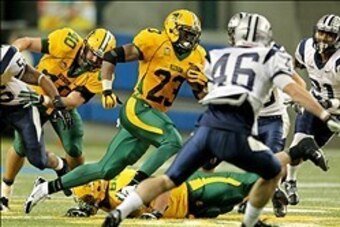 Dec 20, 2013; Fargo, ND, USA; North Dakota State Bison running back John Crockett (23) carries the ball during the second quarter against the New Hampshire Wildcats at FargoDome. Mandatory Credit: Brace Hemmelgarn-USA TODAY Sports