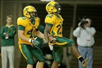 Dec 20, 2013; Fargo, ND, USA; North Dakota State Bison running back Sam Ojuri (22) celebrates his touchdown with fullback Andrew Grothmann (40) during the fourth quarter against the New Hampshire Wildcats at FargoDome. North Dakota State defeated New Hamp