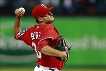Sep 30, 2013; Arlington, TX, USA; Texas Rangers starting pitcher Martin Perez throws a pitch against the Tampa Bay Rays during the first inning at Rangers Ballpark at Arlington. Mandatory Credit: Tim Heitman-USA TODAY Sports