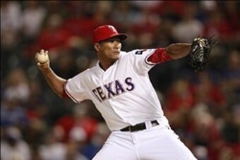 Aug 22, 2012; Arlington, TX, USA; Texas Rangers pitcher Alexi Ogando (41) throws a pitch during the ninth inning of the game against the Baltimore Orioles at Rangers Ballpark. The Rangers beat the Orioles 12-3. Mandatory Credit: Tim Heitman-USA TODAY Spor