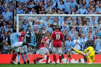 LONDON, ENGLAND - MAY 14:  Yaya Toure of Manchester City scores the opening goal during the FA Cup sponsored by E.ON Final match between Manchester City and Stoke City at Wembley Stadium on May 14, 2011 in London, England.  (Photo by Shaun Botterill/Getty