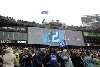 SEATTLE, WA - SEPTEMBER 25:  The 12th man is honored before the game against the Seattle Seahawks at CenturyLink Field on September 25, 2011 in Seattle, Washington.  (Photo by Harry How/Getty Images)