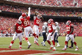 KANSAS CITY, MO - SEPTEMBER 30: Tamba Hali #91 and Justin Houston #50 of the Kansas City Chiefs celebrate after a sack against the San Diego Chargers during the game at Arrowhead Stadium on September 30, 2012 in Kansas City, Missouri. The Chargers won 37-