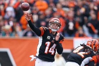 CINCINNATI, OH - DECEMBER 22:  Andy Dalton #14 of the Cincinnati Bengals throws a pass during the NFL game against the Minnesota Vikings at Paul Brown Stadium on December 22, 2013 in Cincinnati, Ohio.  (Photo by Andy Lyons/Getty Images)