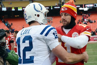 Dec 22, 2013; Kansas City, MO, USA; Kansas City Chiefs quarterback Alex Smith (11) congratulates Indianapolis Colts quarterback Andrew Luck (12) after the game at Arrowhead Stadium. The Colts won 23-7. Mandatory Credit: Denny Medley-USA TODAY Sports