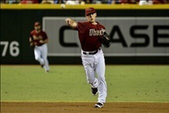 Sep 18, 2013; Phoenix, AZ, USA; Arizona Diamondbacks shortstop Chris Owings (16) throws to first base during the first inning against the Los Angeles Dodgers at Chase Field. Mandatory Credit: Matt Kartozian-USA TODAY Sports