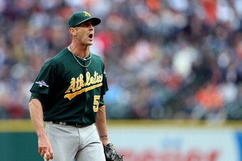 DETROIT, MI - OCTOBER 07: Grant Balfour #50 of the Oakland Athletics exchanges words with Victor Martinez #41 of the Detroit Tigers in the ninth inning during Game Three of the American League Division Series at Comerica Park on October 7, 2013 in Detroit