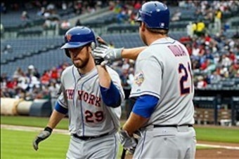 April 18, 2012; Atlanta, GA, USA; New York Mets first baseman Ike Davis (29) celebrates with right fielder Lucas Duda (21) after scoring a run in the second inning against the Atlanta Braves at Turner Field. Mandatory Credit: Daniel Shirey-USA TODAY Sport
