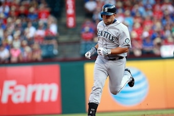 ARLINGTON, TX - JULY 2: Kendrys Morales #8 of the Seattle Mariners runs the bases after hitting a home run against the Texas Rangers in the first inning at Rangers Ballpark in Arlington on July 2, 2013 in Arlington, Texas. (Photo by Rick Yeatts/Getty Imag