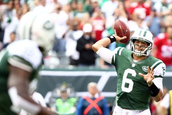 Sept. 30, 2012; East Rutherford, NJ, USA; New York Jets quarterback Mark Sanchez (6) throws to wide receiver Santonio Holmes (10) during the first quarter against the San Francisco 49ers at MetLife Stadium. Mandatory Credit: Debby Wong-USA TODAY Sports
