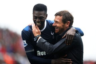 STOKE ON TRENT, ENGLAND - MAY 12:  Match winning goalscorer Emmanuel Adebayor is congratulated by Spurs manager Andre Villas-Boas following the final whistle during the Barclays Premier League match between Stoke City and Tottenham Hotspur at Britannia St