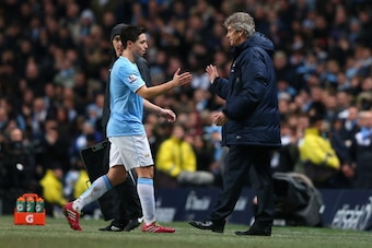 MANCHESTER, ENGLAND - DECEMBER 26:  Samir Nasri of Manchester City shakes hands with Manuel Pellegrini the manager of Manchester City after being substituted during the Barclays Premier League match between Manchester City and Liverpool at Etihad Stadium 