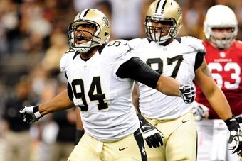 NEW ORLEANS, LA - SEPTEMBER 22:  Cameron Jordan #94 of the New Orleans Saints reacts to a sack against the Arizona Cardinals during a game at the Mercedes-Benz Superdome on September 22, 2013 in New Orleans, Louisiana.  (Photo by Stacy Revere/Getty Images