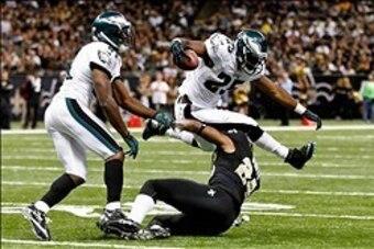 November 5, 2012; New Orleans, LA, USA; Philadelphia Eagles running back LeSean McCoy (25) leaps over New Orleans Saints cornerback Corey White (24) during the second half of a game at the Mercedes-Benz Superdome. The Saints defeated the Easgles 28-13. Ma