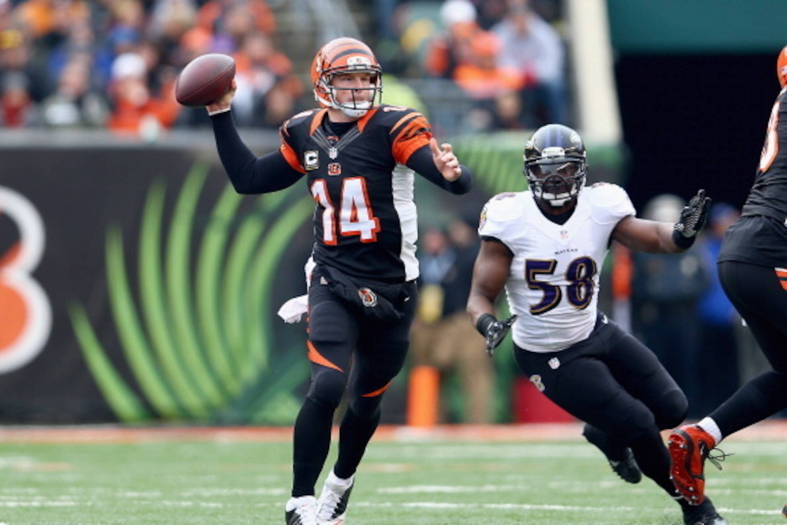 CINCINNATI, OH - DECEMBER 29:  Andy Dalton #14 of the Cincinnati Bengals throws a pass during the NFL game against the Baltimore Ravens  at Paul Brown Stadium on December 29, 2013 in Cincinnati, Ohio.  (Photo by Andy Lyons/Getty Images)