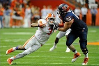 Oct 5, 2013; Syracuse, NY, USA; Clemson Tigers defensive end Vic Beasley (3) is blocked by Syracuse Orange offensive tackle Sean Hickey (60) during the third quarter at the Carrier Dome.  Clemson defeated Syracuse 49-14.  Mandatory Credit: Rich Barnes-USA
