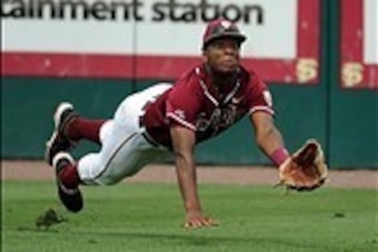 Jun 8, 2013; Tallahassee, FL, USA; Florida State Seminoles right fielder Jameis Winston (44) cannot make a catch for an out the game against the Indiana Hoosiers during the Tallahassee super regional of the 2013 NCAA baseball tournament at Dick Howser Sta