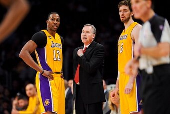 LOS ANGELES, CA - APRIL 17: Head Coach Mike D'Antoni of the Los Angeles Lakers speaks with Dwight Howard #12 and Pau Gasol #16 during a game against the Houston Rockets at Staples Center on April 17, 2013 in Los Angeles, California. NOTE TO USER: User exp