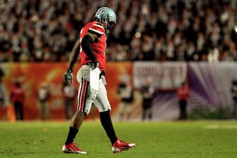 MIAMI GARDENS, FL - JANUARY 03: Braxton Miller #5 of the Ohio State Buckeyes walks off the field after throwing an interception in the third quarter against the Clemson Tigers during the Discover Orange Bowl at Sun Life Stadium on January 3, 2014 in Miami