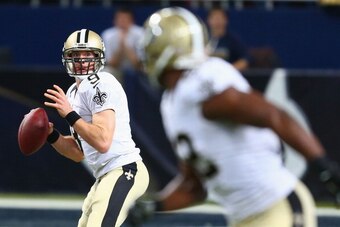 ST. LOUIS, MO - DECEMBER 15: Drew Brees #9 of the New Orleans Saints passes against the St. Louis Rams at the Edward Jones Dome on December 15, 2013 in St. Louis, Missouri.  The Rams beat the Saints 27-16.  (Photo by Dilip Vishwanat/Getty Images)