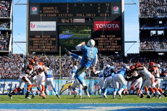 SAN DIEGO, CA - DECEMBER 01:  Punter Mike Scifres #5 of the San Diego Chargers punts against the Cincinnati Bengals at Qualcomm Stadium on December 1, 2013 in San Diego, California. The Bengals won 17-10.  (Photo by Stephen Dunn/Getty Images)