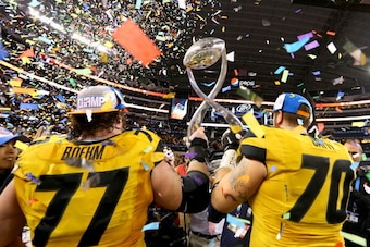 ARLINGTON, TX - JANUARY 03:  Evan Boehm #77 and Anthony Gatti #70 of the Missouri Tigers celebrate after the Tigers defeat the Oklahoma State Cowboys 41-31 during the AT&T Cotton Bowl on January 3, 2014 in Arlington, Texas.  (Photo by Ronald Martinez/Gett