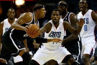 CHARLOTTE, NC - NOVEMBER 20:  Michael Kidd-Gilchrist #14 of the Charlotte Bobcats plays defense against Paul Pierce #34 of the Brooklyn Nets during their game at Time Warner Cable Arena on November 20, 2013 in Charlotte, North Carolina.  NOTE TO USER: Use